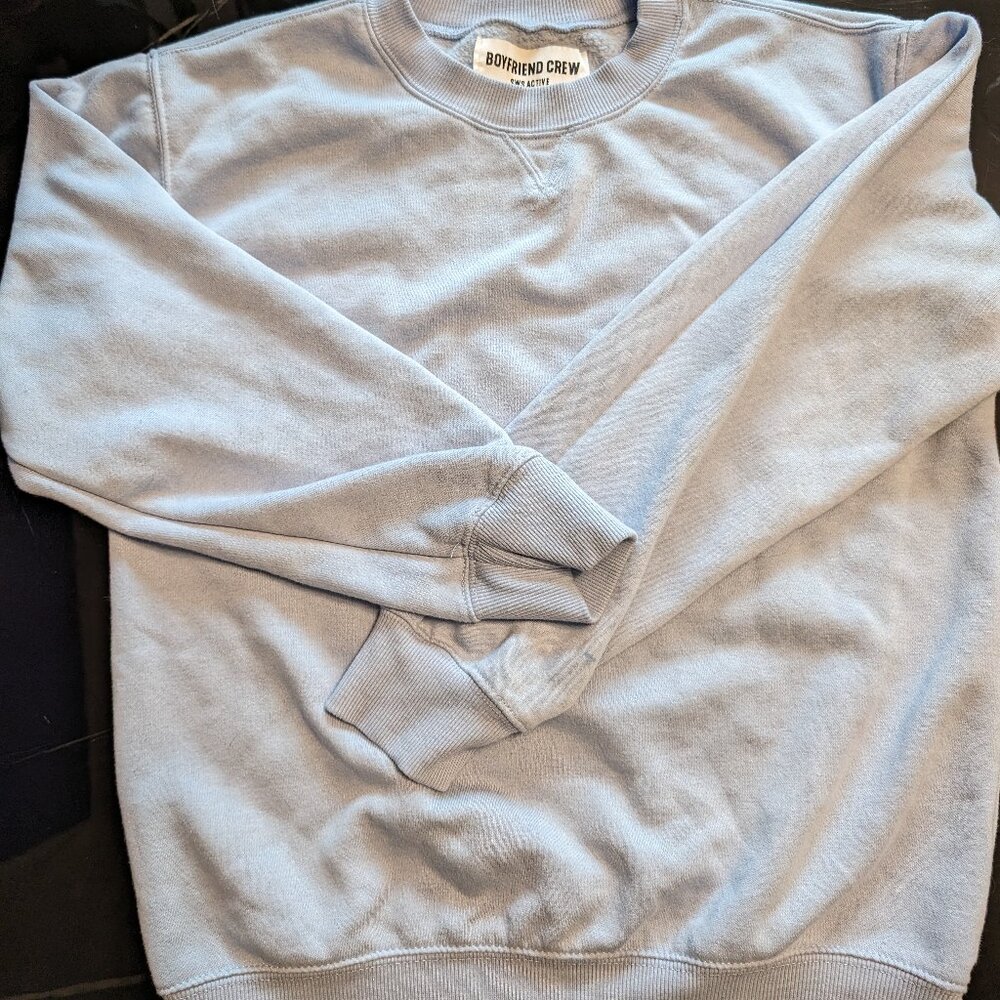Look effortlessly cool in this breezy sky blue, long-sleeved BoyFriend crewneck!